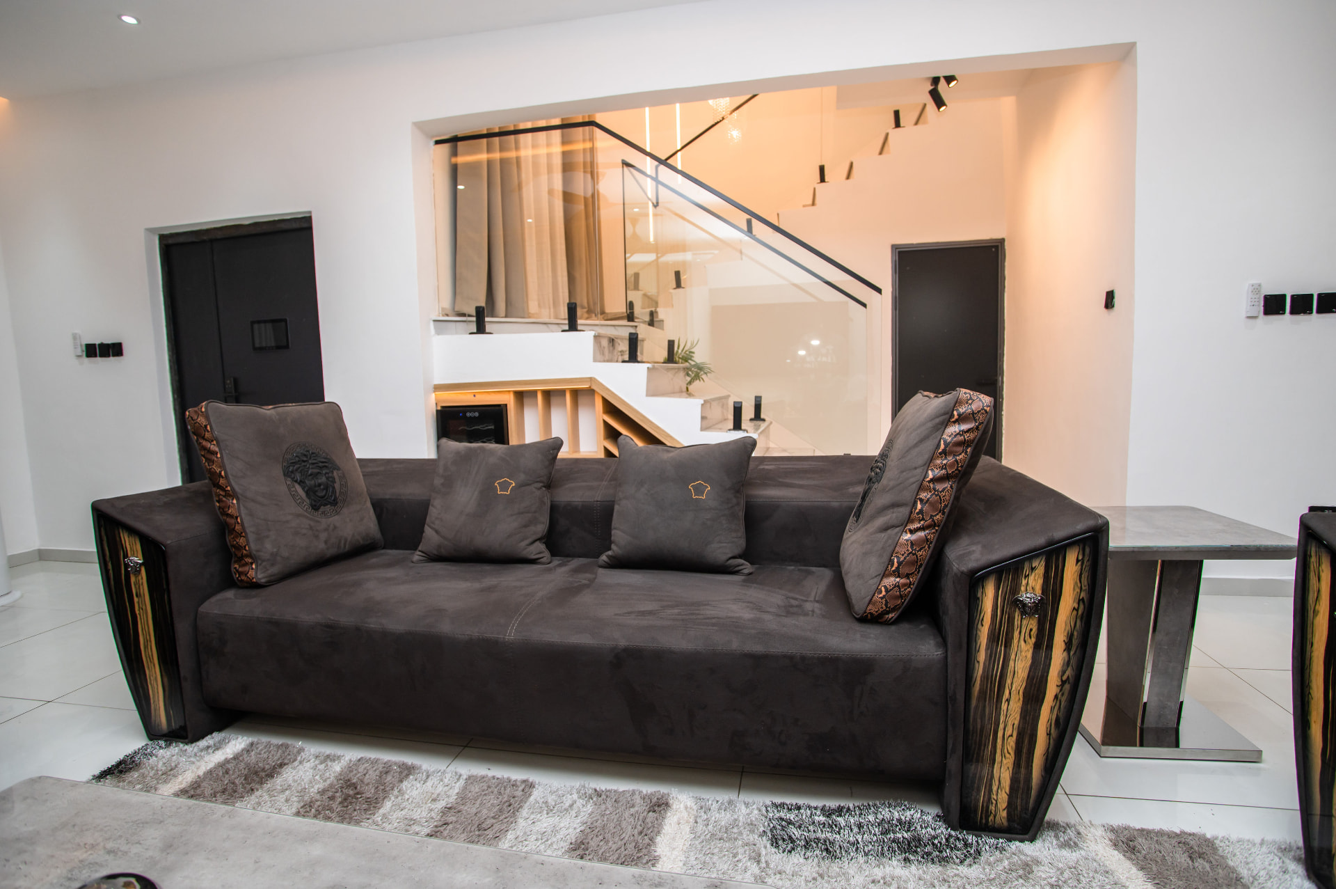 Lounge seating and staircase at Pryse Enclave