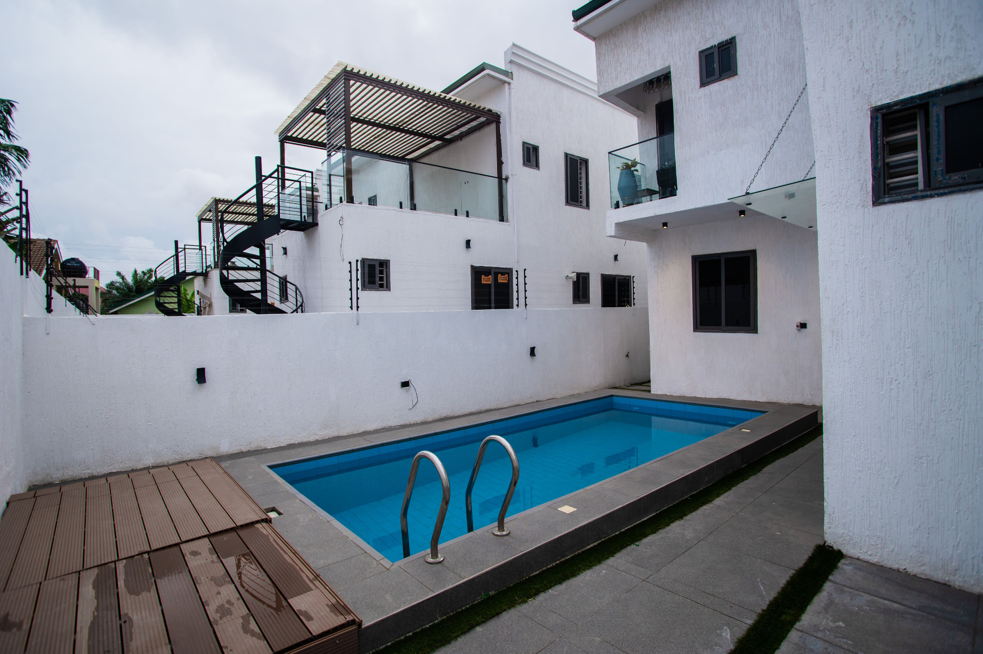 Swimming pool and terraces at Pryse Enclave