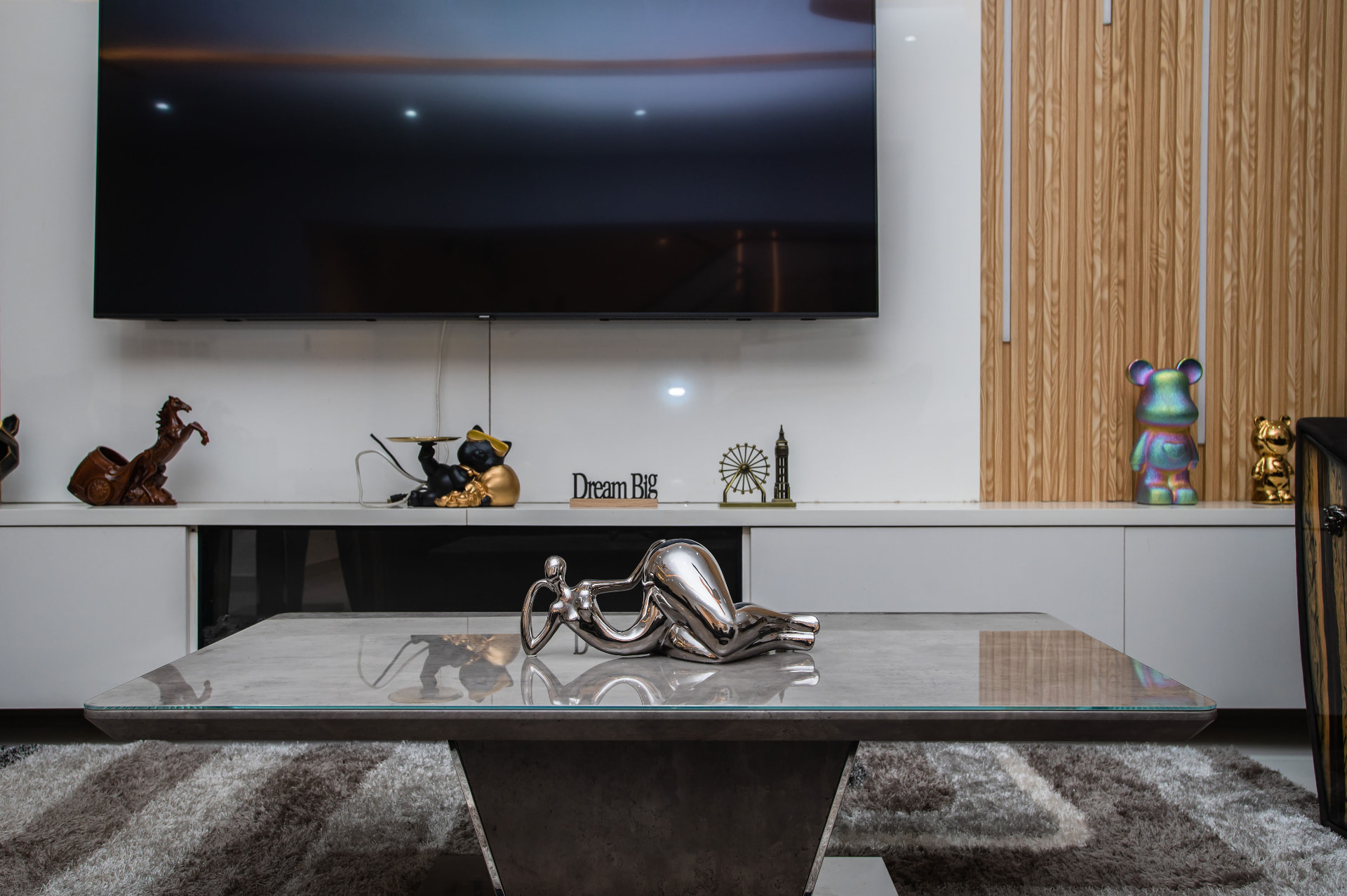 Media wall and coffee table detail at Pryse Enclave